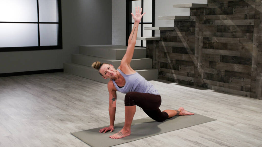 Wellbeats instructor Jodee T. leads a yoga stretch